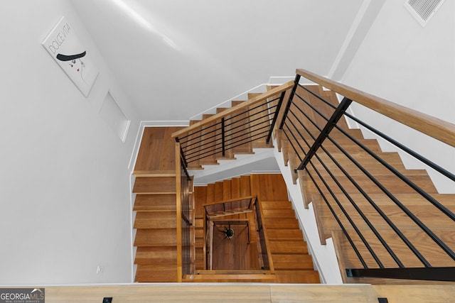 staircase featuring hardwood / wood-style floors