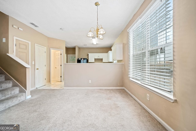 interior space with a notable chandelier