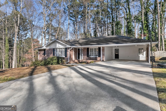 ranch-style home featuring a carport