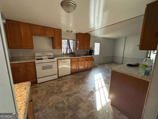 kitchen featuring sink and white appliances