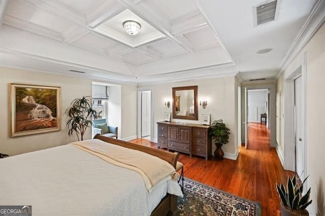 bedroom with baseboards, visible vents, coffered ceiling, and wood finished floors