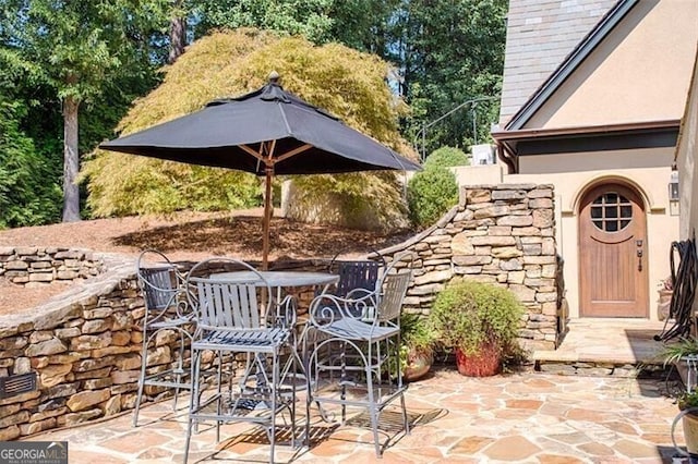 view of patio with outdoor dining area