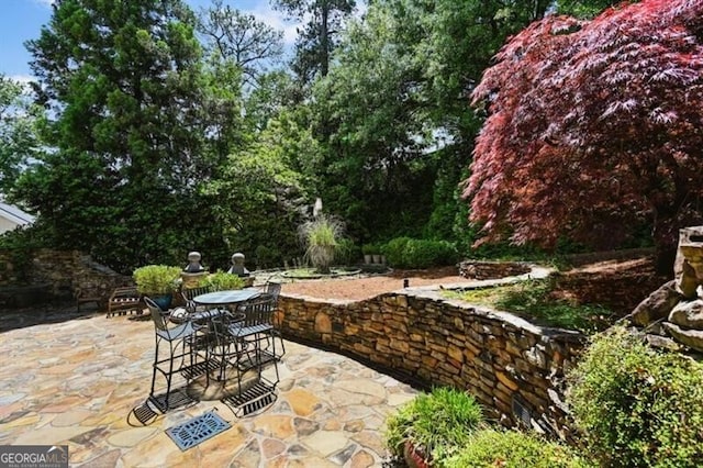 view of patio featuring outdoor dining area