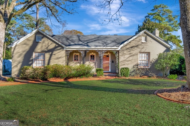 ranch-style home with a front lawn