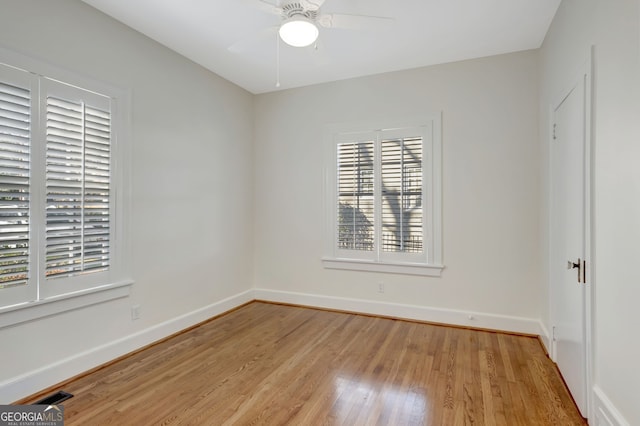 empty room featuring light wood-type flooring and ceiling fan