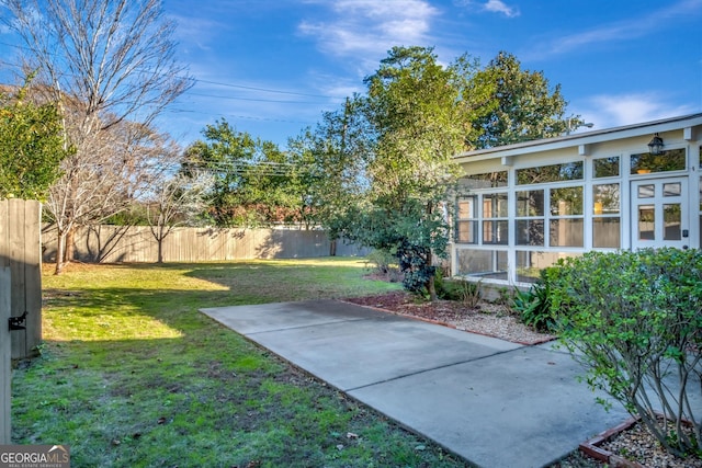 view of yard with a patio and a sunroom