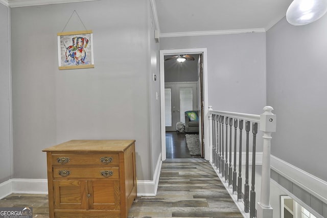 corridor with crown molding and dark hardwood / wood-style floors