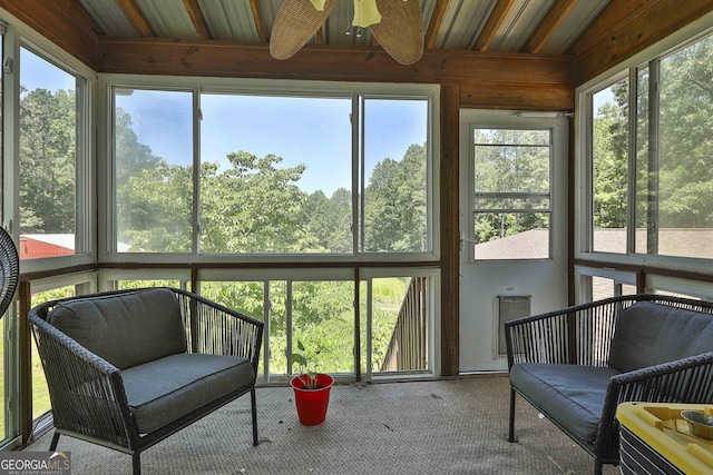 sunroom with ceiling fan and a healthy amount of sunlight