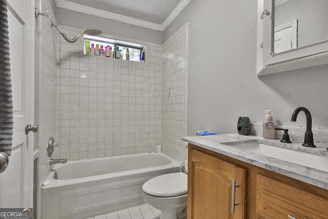 full bathroom with tiled shower / bath, ornamental molding, toilet, tile patterned floors, and vanity