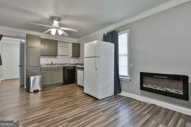 kitchen featuring white appliances, ceiling fan, ornamental molding, dark hardwood / wood-style floors, and sink