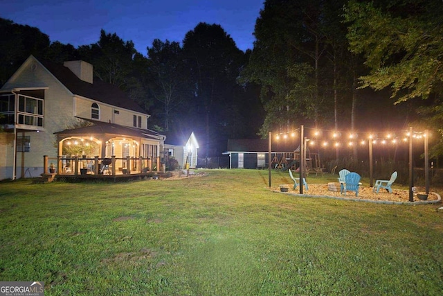 view of yard at twilight