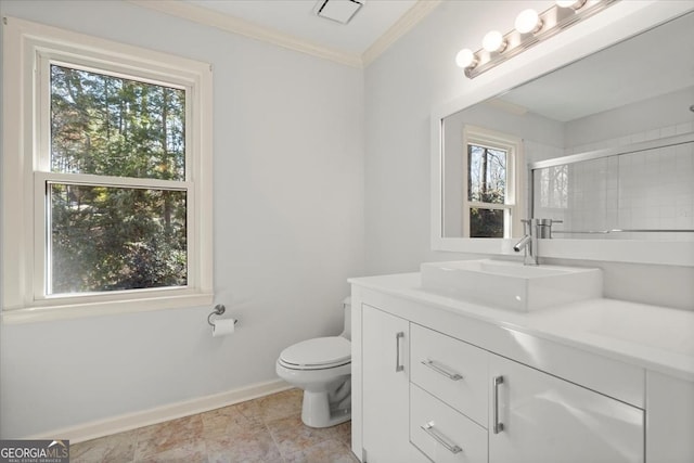 bathroom featuring a shower with door, toilet, vanity, and crown molding