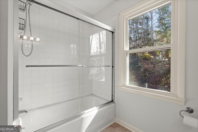 bathroom featuring enclosed tub / shower combo