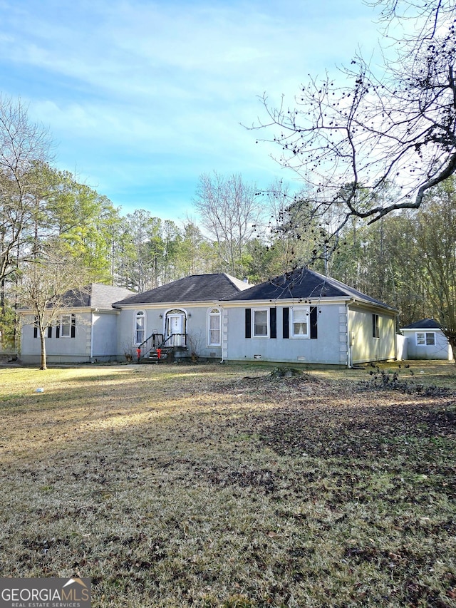 ranch-style house with a front yard