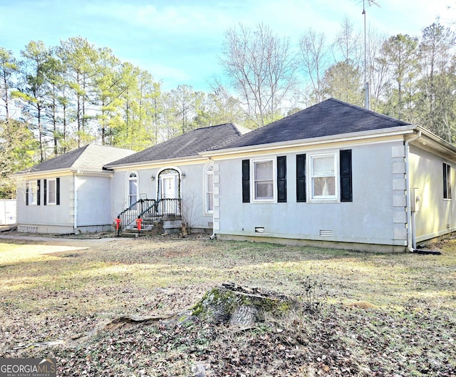 single story home with crawl space, a shingled roof, and stucco siding