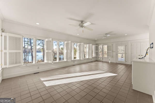 unfurnished sunroom with ceiling fan