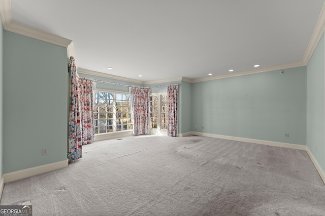 unfurnished room with crown molding and light colored carpet