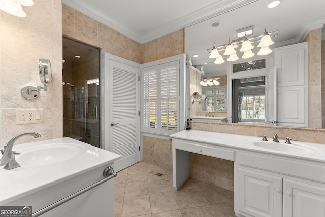 bathroom featuring crown molding, tile walls, vanity, and tile patterned floors