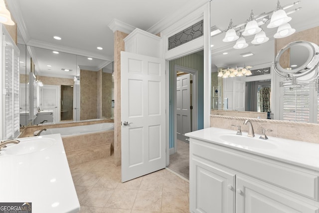 bathroom featuring tile patterned flooring, vanity, ornamental molding, and tiled bath