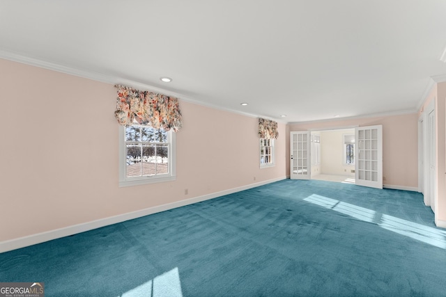 empty room featuring ornamental molding, french doors, and carpet flooring