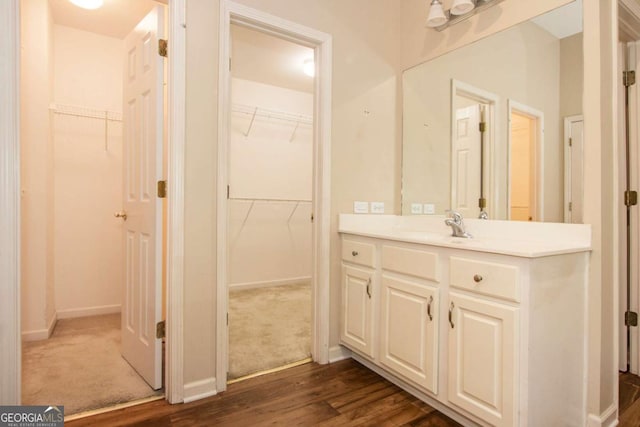 bathroom with vanity and hardwood / wood-style floors