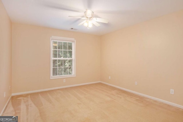 carpeted empty room with ceiling fan