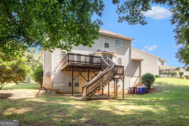 back of house featuring a deck and a yard