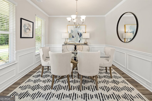 dining room featuring crown molding, plenty of natural light, and a notable chandelier