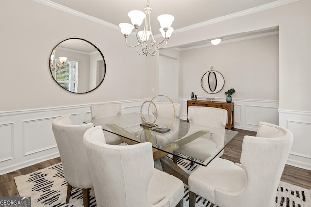 dining room featuring a chandelier, crown molding, and dark hardwood / wood-style floors