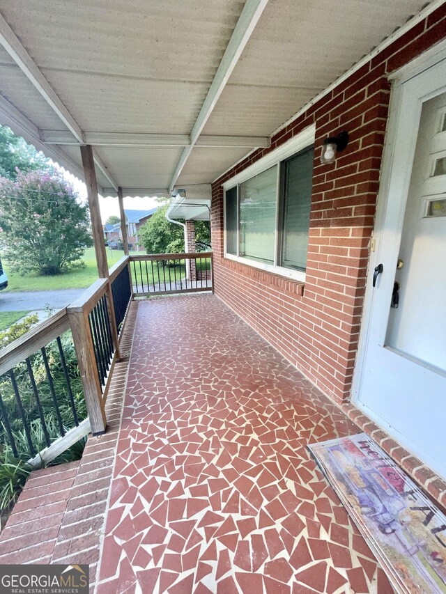 view of patio featuring a porch