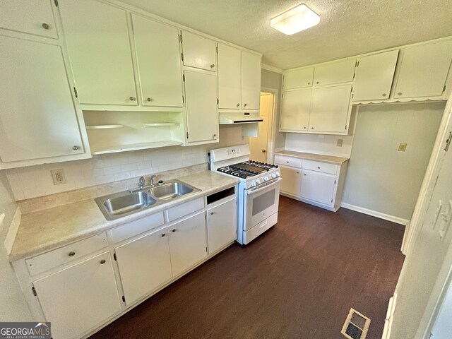 kitchen with a textured ceiling, dark wood-type flooring, sink, white cabinetry, and white range with gas stovetop