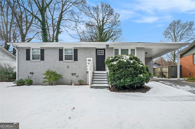 view of front of property featuring a carport