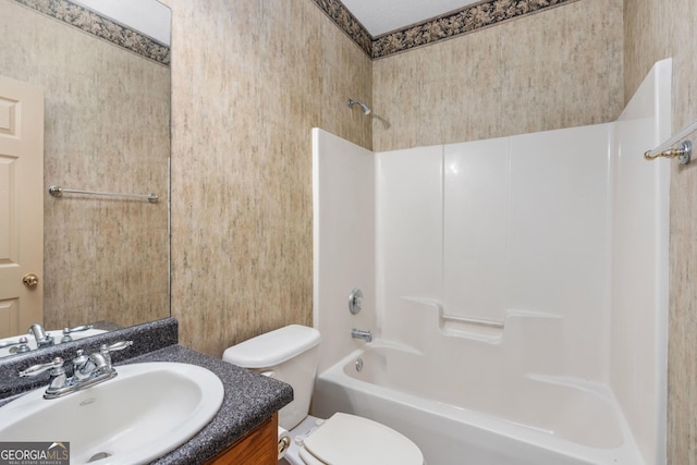 full bathroom featuring shower / bath combination, vanity, and toilet