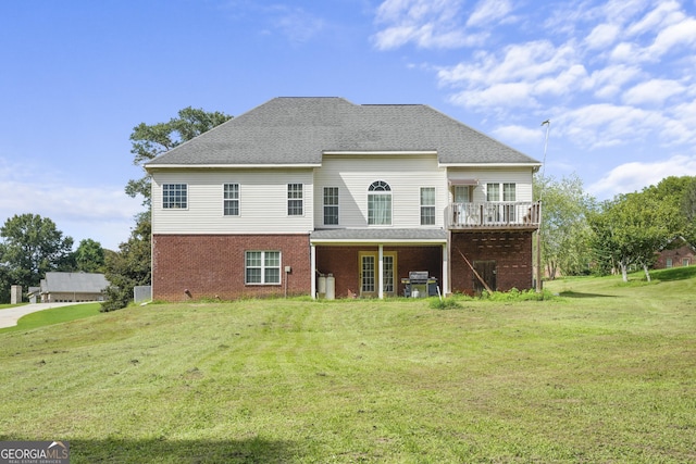 back of house with a yard and a wooden deck