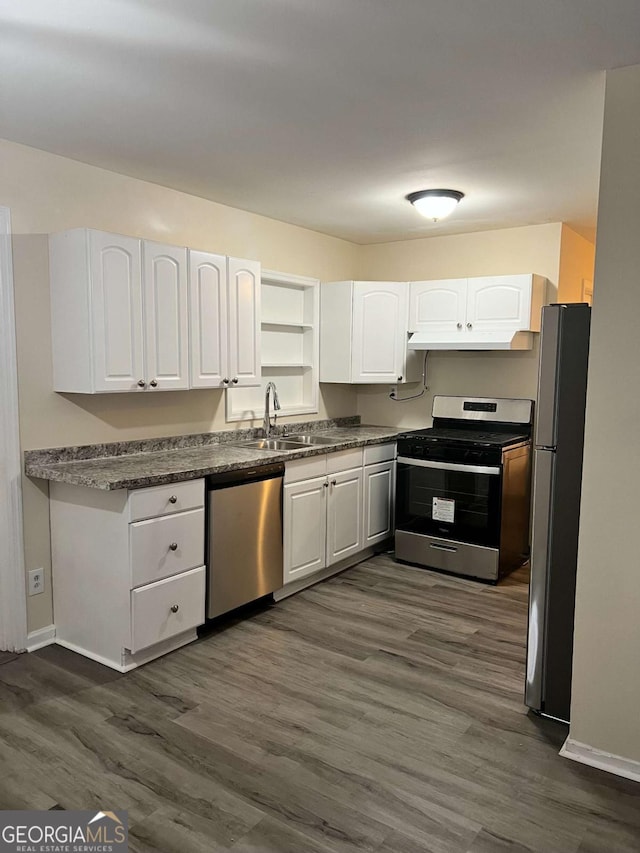 kitchen featuring sink, white cabinetry, dark hardwood / wood-style floors, and appliances with stainless steel finishes