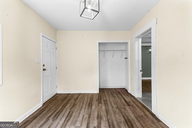 hall with dark hardwood / wood-style flooring