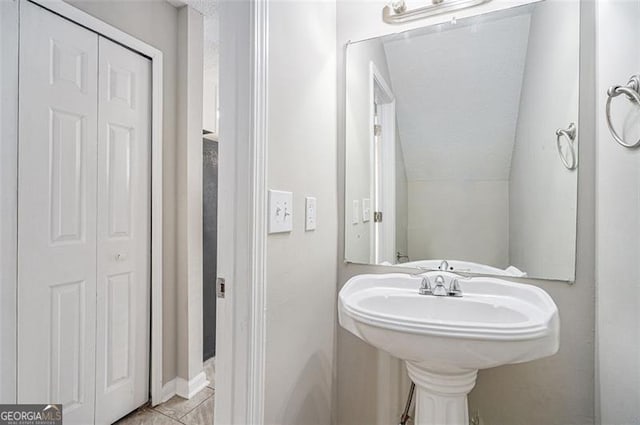 bathroom with vaulted ceiling