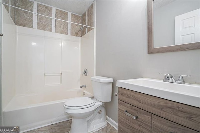 full bathroom featuring toilet, shower / bathing tub combination, a textured ceiling, and vanity