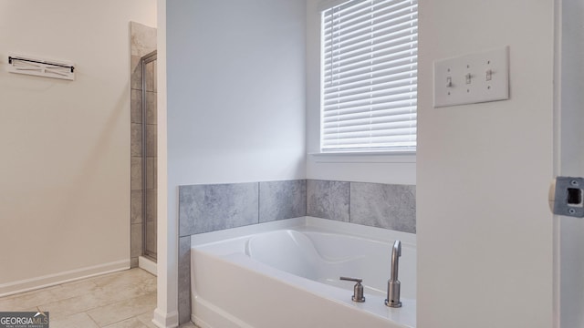 bathroom featuring plus walk in shower and tile patterned floors