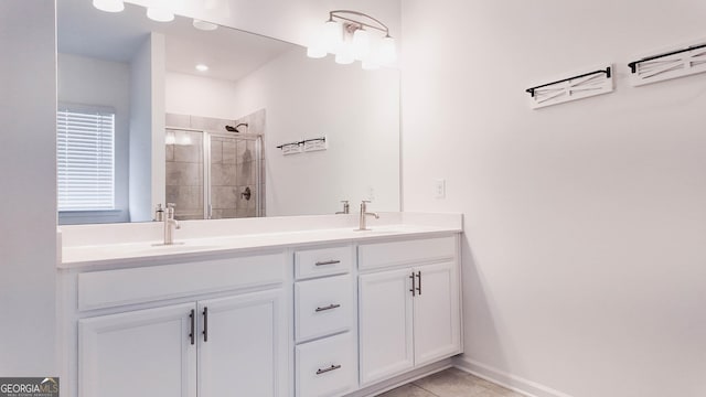 bathroom featuring tile patterned floors, walk in shower, and vanity