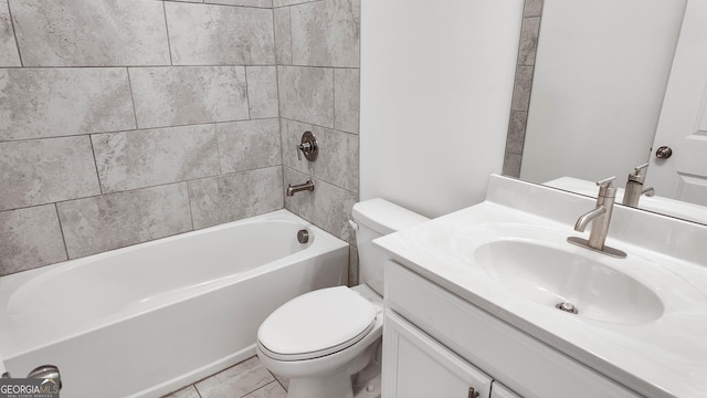 full bathroom featuring toilet, tiled shower / bath combo, and vanity