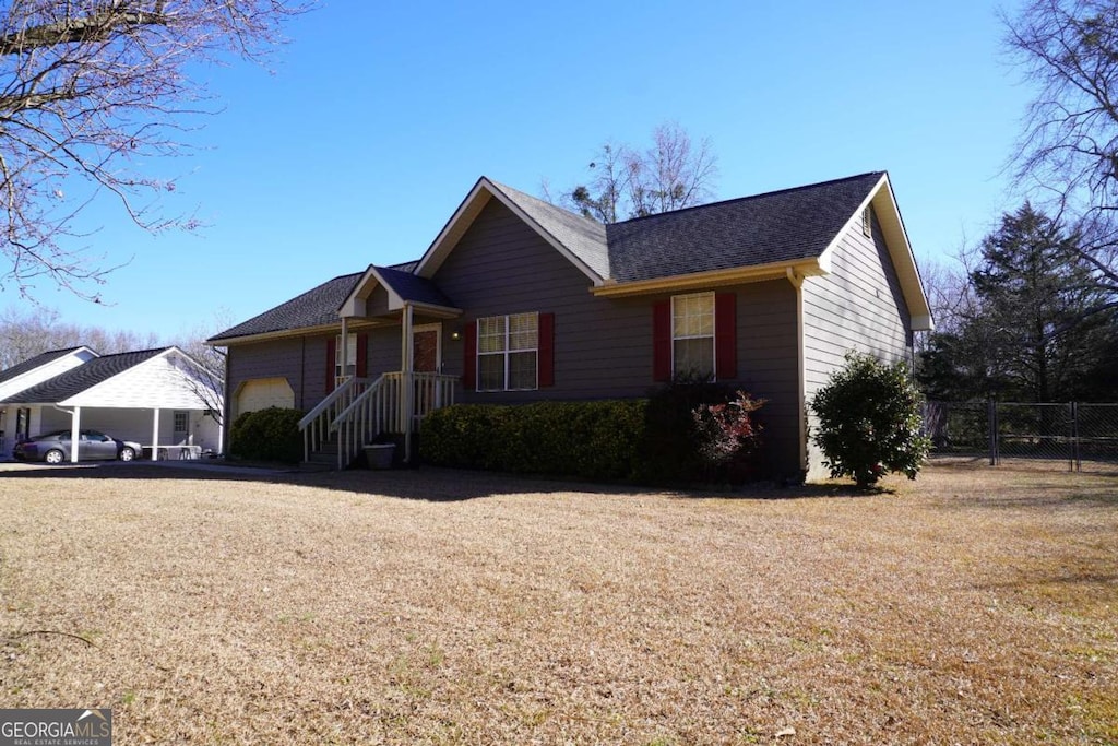 ranch-style house featuring a carport