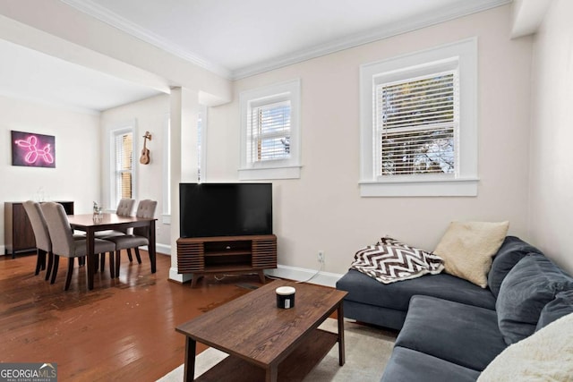 living room with hardwood / wood-style floors and crown molding