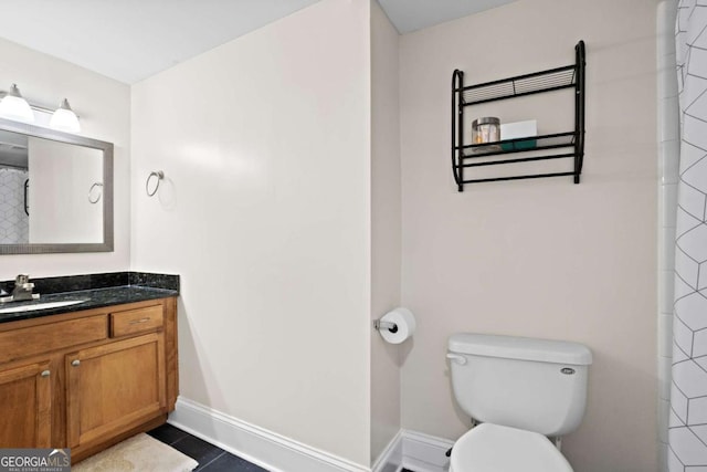 bathroom featuring toilet, tile patterned flooring, a shower with curtain, and vanity