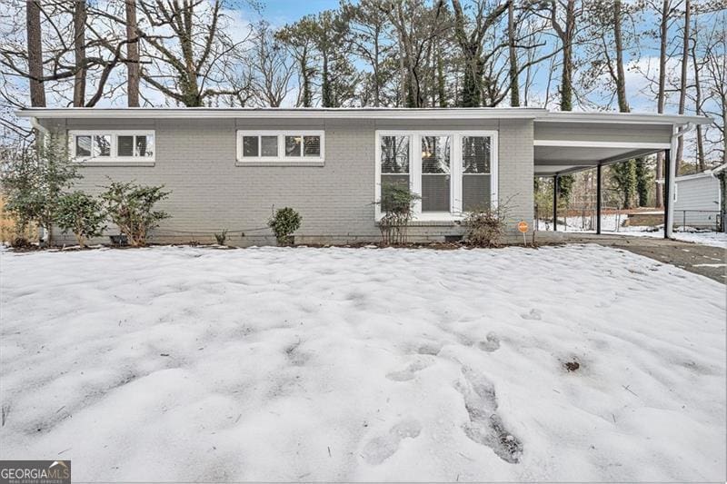 view of front of property with a carport