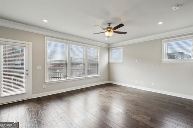 unfurnished room with crown molding, ceiling fan, and dark hardwood / wood-style flooring