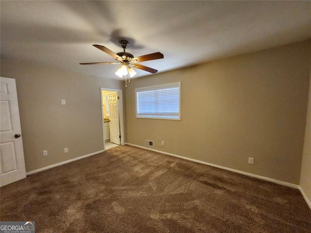 unfurnished bedroom with ceiling fan, ensuite bath, and carpet