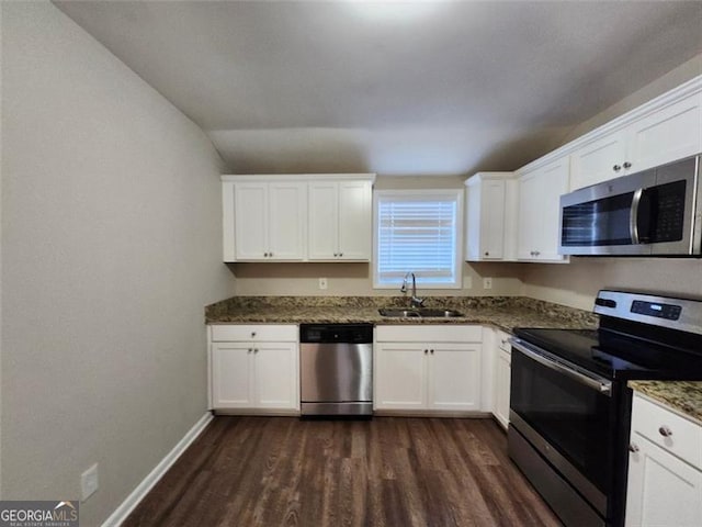 kitchen with sink, white cabinets, and appliances with stainless steel finishes