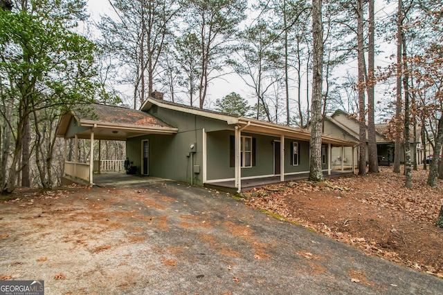 ranch-style house with a carport