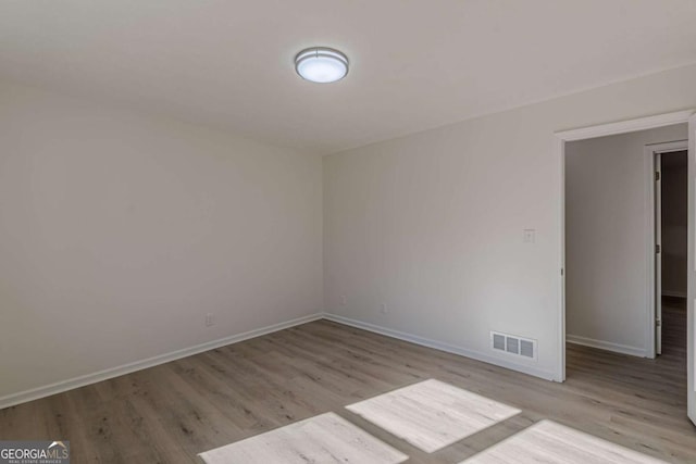 empty room with light wood-type flooring